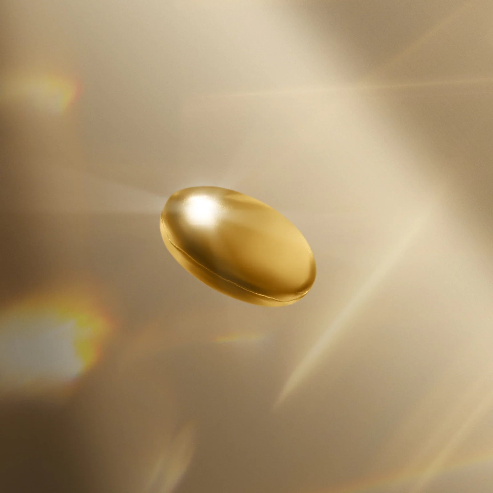 Close-up of a golden capsule suspended against a softly lit gold background.