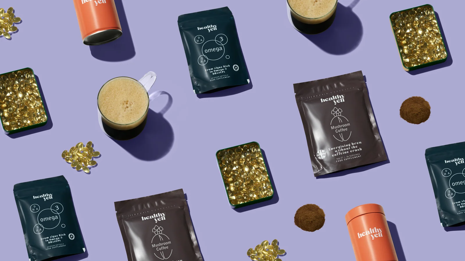 Healthy Yeti pouches, orange tins, cups of coffee and capsule tins arranged in a repeating pattern on lilac.
