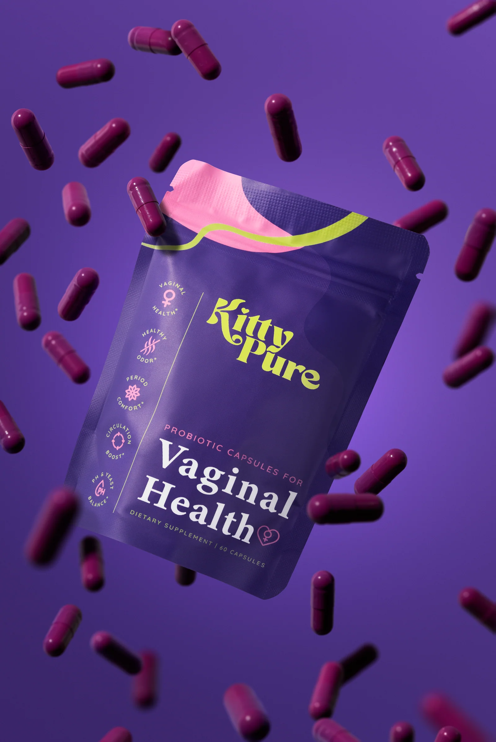 KittyPure Vaginal Health supplement pouch surrounded by suspended purple capsules against deep purple.