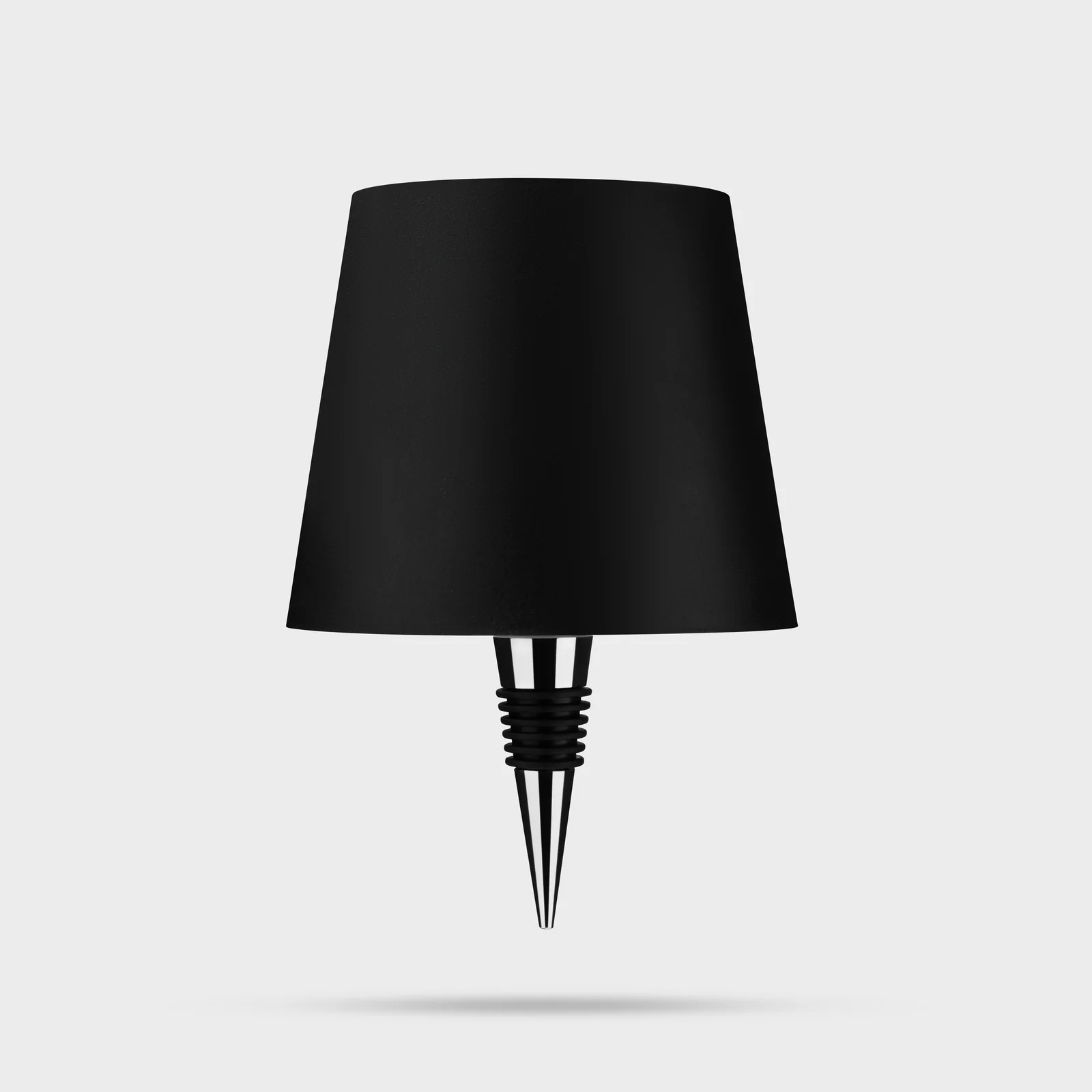 Black Liquor Lit bottle lamp top with its tapered fitting visible against white.