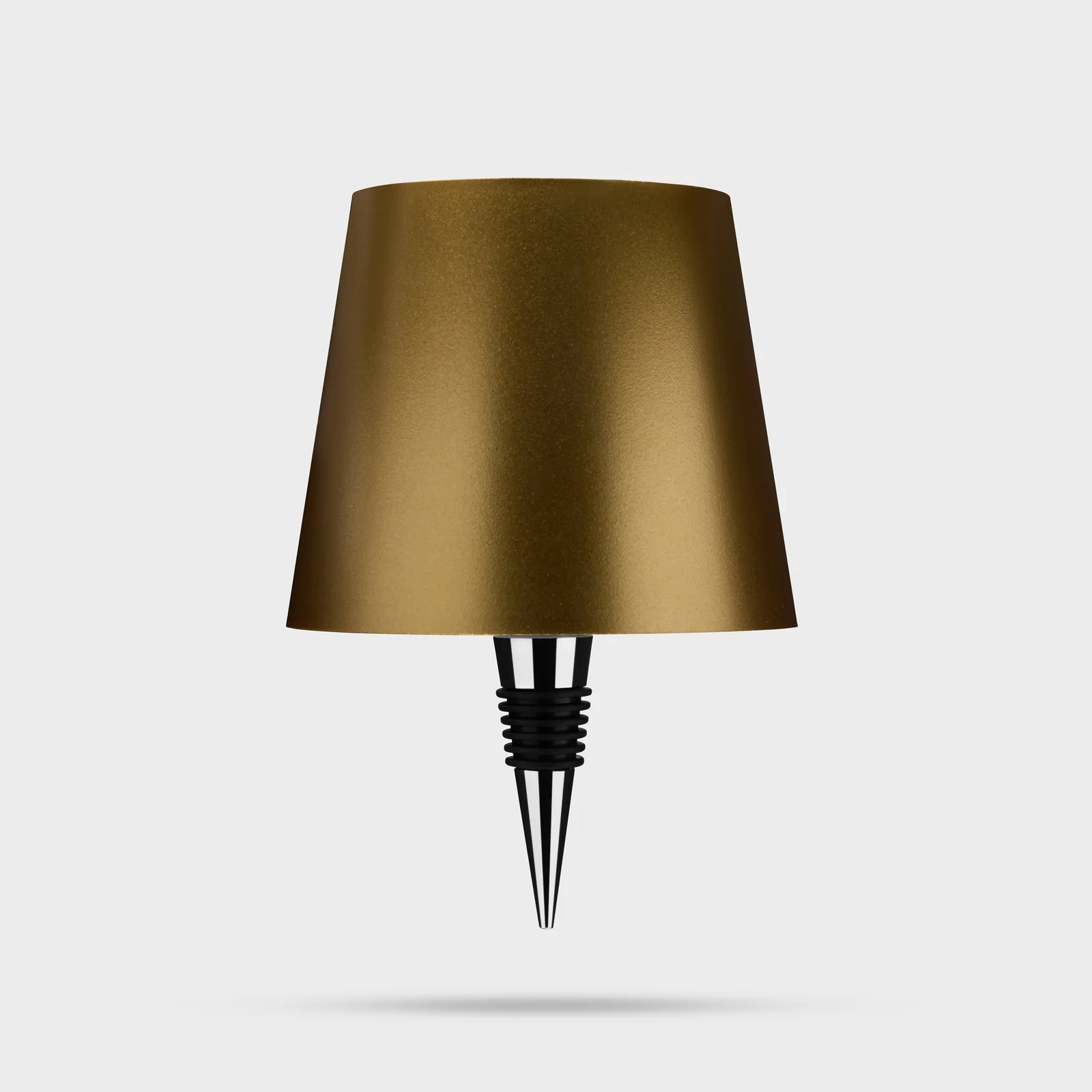 Gold Liquor Lit bottle lamp top with its tapered fitting visible against white.