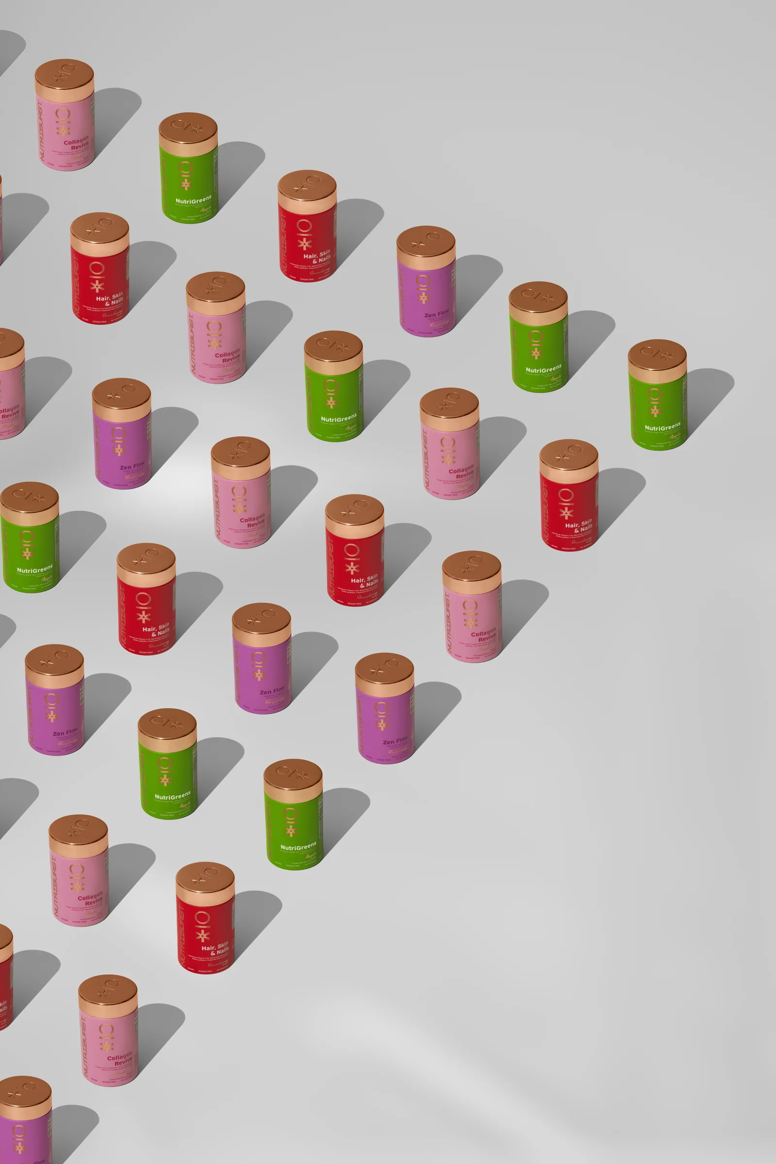 Colourful Nutriburst jars arranged in repeating diagonal rows on a light background.