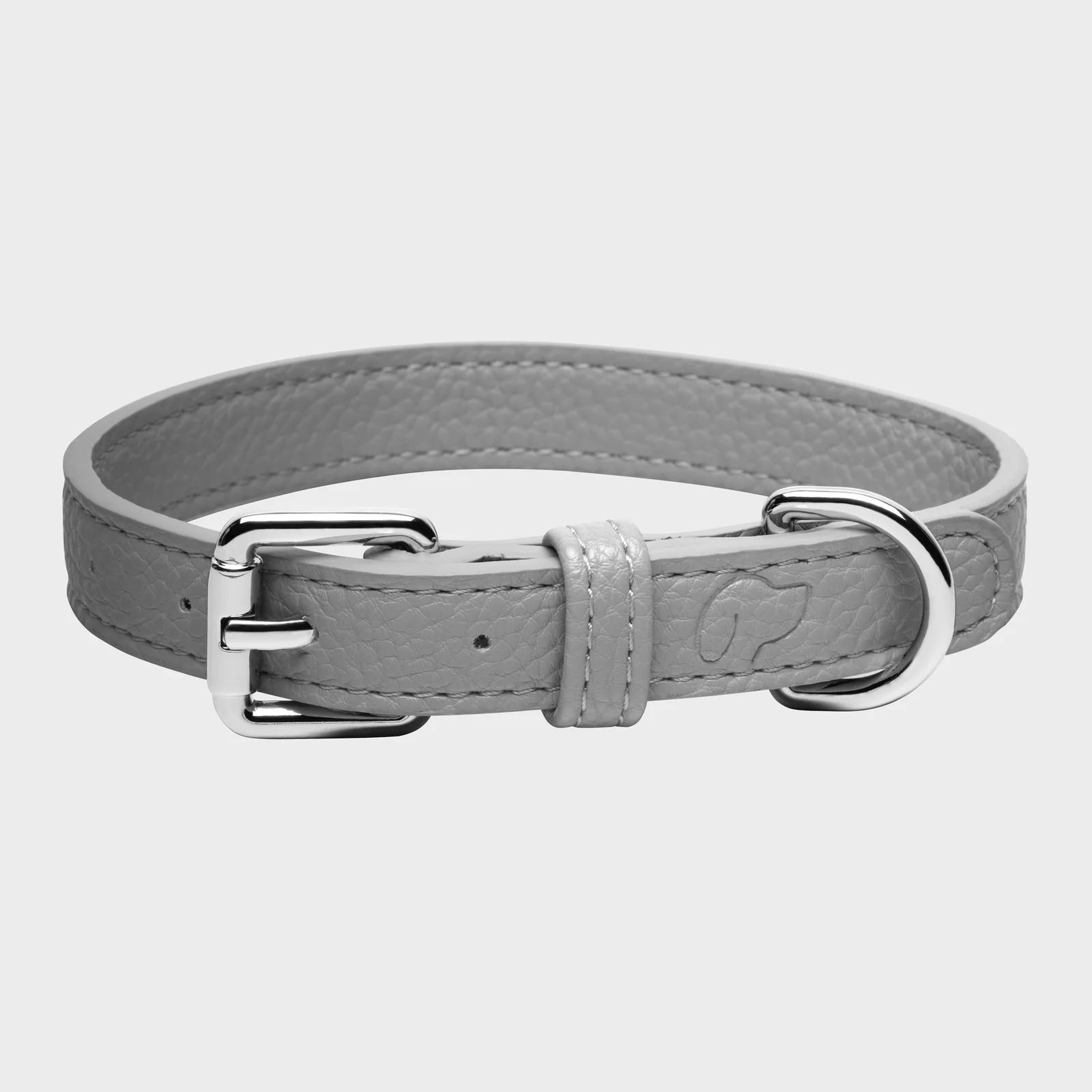 Grey Truffle and Paw leather collar with a silver-coloured buckle and ring on a light background.
