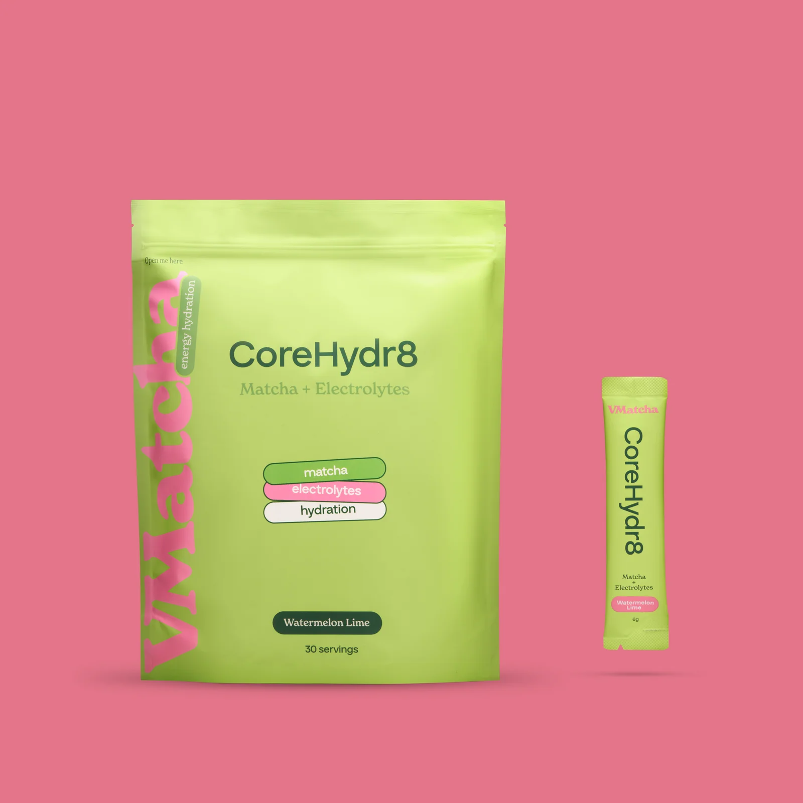 Lime-green VMatcha CoreHydr8 pouch and matching sachet against a pink background.