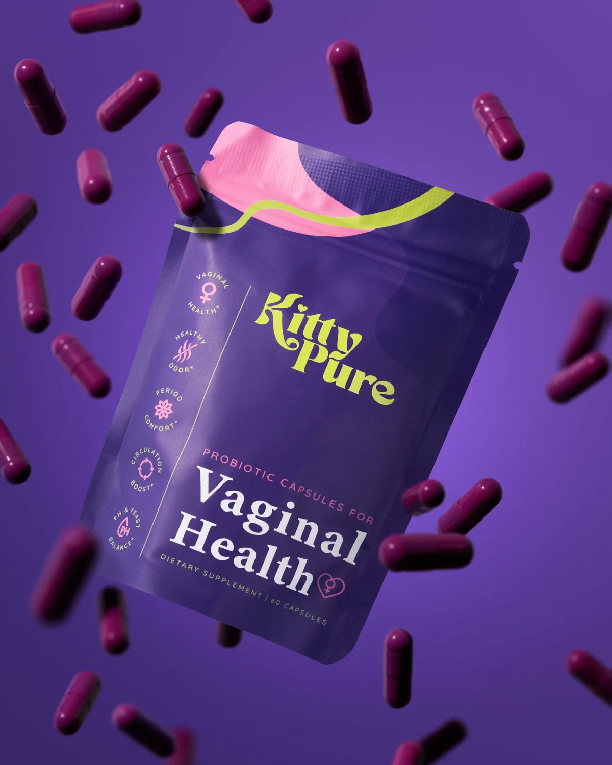 Purple KittyPure pouch surrounded by floating purple capsules against purple.