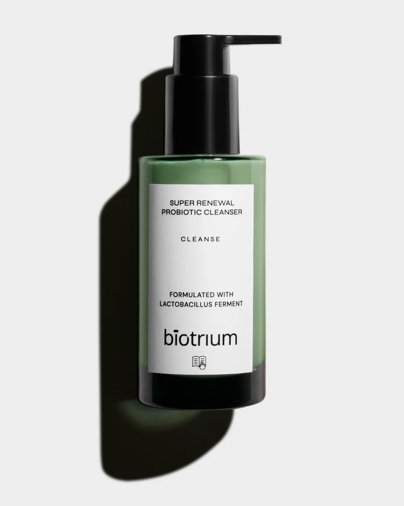 Green Biotrium cleanser bottle with black pump photographed on a light background.